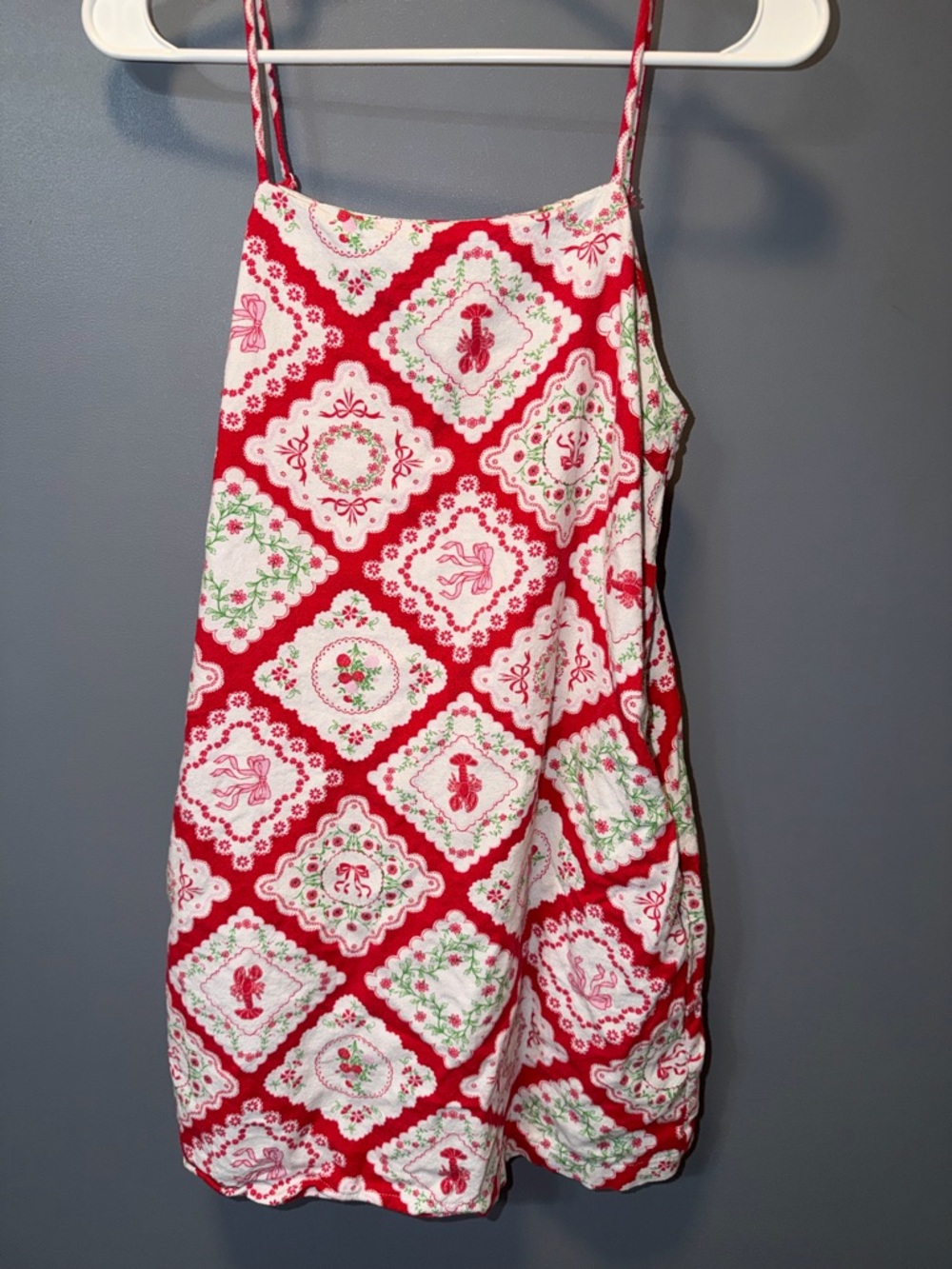 Woman’s Red and White Spaghetti-Strap Dress with Floral Lobster Wreath Detail